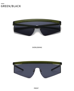 Detail view showing oversized geometric pilot sunglasses with olive green top frame