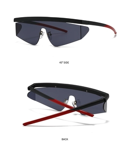 Detail view of sport aviator sunglasses with black red frame and wide grey shield lens