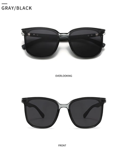 Front and top views of gray-black polarized sunglasses with metal accents on frames