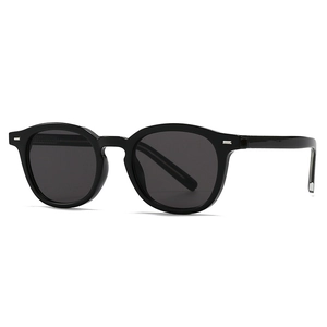 Classic retro round frame black sunglasses with decorative silver metal rivets on the side