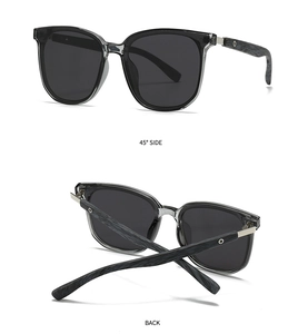 Detail of polarized sunglasses with grey wood grain temples and silver metal accents