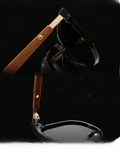 Detail of premium sunglasses with wood texture temples and reinforced gold metal hinges