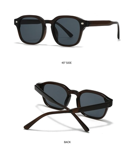 Detail view of square vintage sunglasses with silver rivets and dark grey lenses
