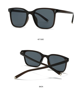 Detail view of square double-bridge sunglasses with dark translucent frames and silver rivets