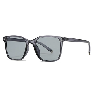 Modern retro square double bridge sunglasses in transparent grey with metal rivet details