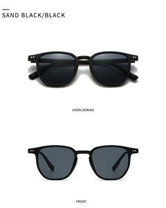 Vue détaillée des lunettes de soleil rétro noir mat avec rivets métalliques argentés
