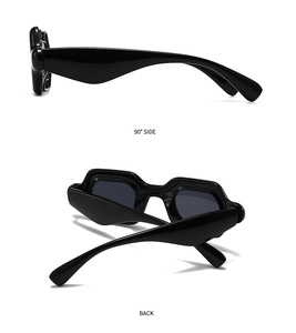 Detail view showing the wave-shaped side profile and back hinge of black sunglasses