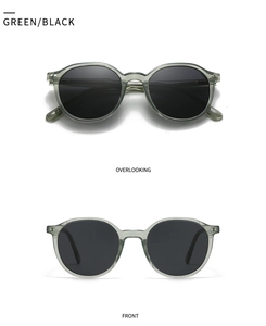 Vertical view of retro green round frame sunglasses with dark lenses and front overlook
