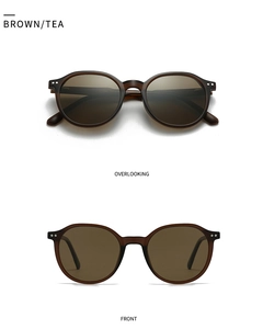 Detail of round matte brown sunglasses with silver rivets and polarized lenses