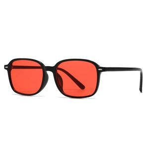 Modern retro square double-bridge sunglasses with black frame and vibrant red lenses