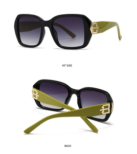 Detail view of square sunglasses with olive green temples and gold metal logo accents