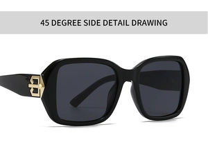 Close-up of square black sunglasses with gold metal logo detail on the temple hinge