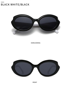Macro view of futuristic wave-shaped frame sunglasses with black and white color block