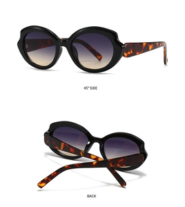 Detail view of cat eye sunglasses featuring thick black frames and tortoise temples