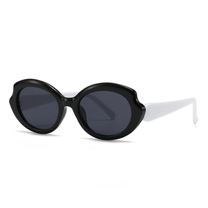 Futuristic black wave frame sunglasses with contrasting white temples and dark grey lenses