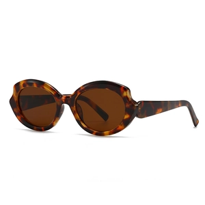 Futuristic polygon tortoiseshell sunglasses with thick frames and dark brown lenses