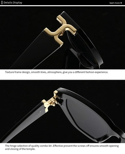 Detail of luxury square sunglasses featuring golden H-shaped metal hinges on black frames