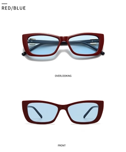 Detail of red square sunglasses with blue lenses and gold metal hinge accents