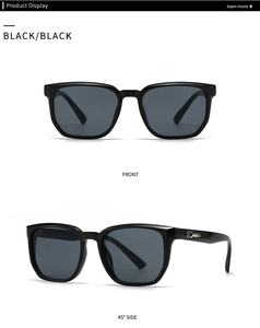 Macro view showing the silver geometric metal trim on black square frame sunglasses