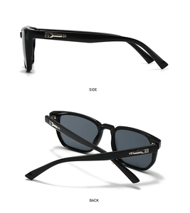 Detail view of black square sunglasses with silver geometric arrow accents on temple