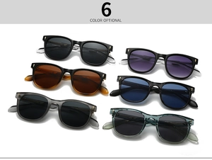 Detail of square sunglasses with golden arrow hinges in black, tortoise and teal colors