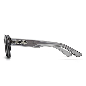 Detailed side view of vintage gear arrow metal decor on translucent gray glasses frame