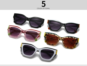 Flat lay of five cat eye sunglasses in various patterns including leopard and color blocking