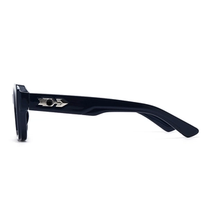 Detail view of glossy black sunglasses featuring silver metal arrow hinges and gear accents