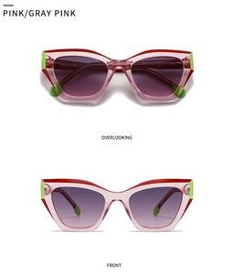 Pink cat-eye sunglasses featuring red accent lines and purple gradient lenses in detail view