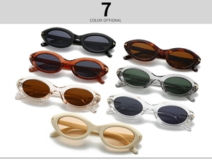 Detail view of seven vintage oval sunglasses featuring signature metal T-hinge accents