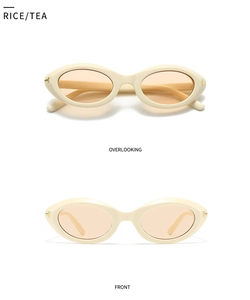 Detail view of the metal T-shaped hinge on rice-colored retro cat-eye sunglasses