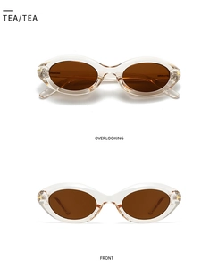 Macro view of retro tea-colored acetate cat-eye sunglasses with gold T-shaped metal hinges
