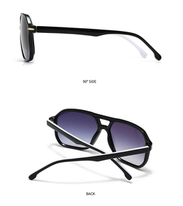 Detail view of stylish gradient lenses and black and white split-color temples on sunglasses