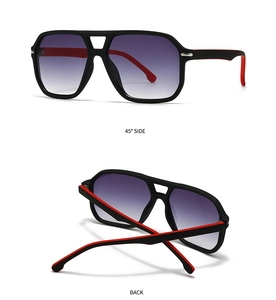 Detail view of aviator sunglasses with matte black frame and red temple accents