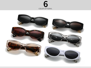 Flat lay of oval retro cat eye sunglasses in six trendy colors with metal accents