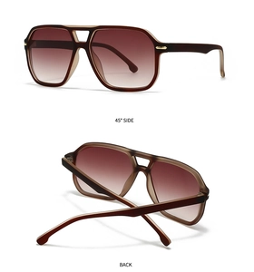 Detail view of tortoiseshell aviator sunglasses with gold accents and gradient lenses