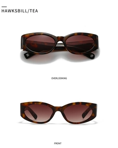 Detailed views of tortoise shell cat eye sunglasses with tea lenses from front and top