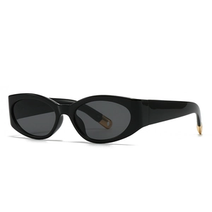 Fashionable oversized cat-eye sunglasses with black frames and gold temple accents