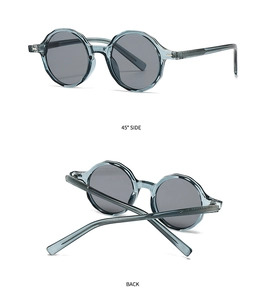 Vue détaillée de lunettes de soleil gris-bleu rondes avec bords polygonaux et verres