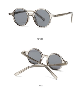 Détail de lunettes de soleil vintage avec verres gris et montures à texture ondulée