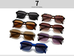 Flat lay of seven stylish geometric sunglasses in diverse colors and patterns on white background