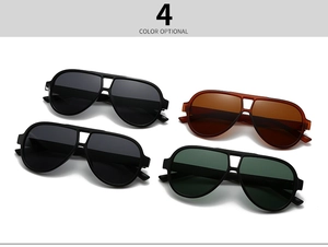 Flat lay of polarized round pilot sunglasses in four color variants on white background