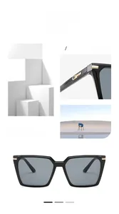 Detail of square black sunglasses featuring gold metal accents on temples and frame