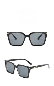 Front and side views of square oversized sunglasses with gold metal hinge accents