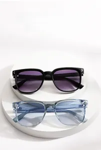 Detail view of square sunglasses with gradient lenses and silver arrow metal accents