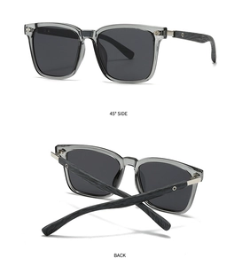 Detail view of polarized sunglasses with grey frames and wooden texture temples