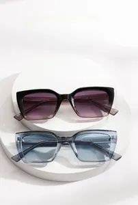 Detail of square oversized sunglasses featuring gradient lenses on a white pedestal