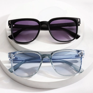 Square fashion sunglasses with gradient purple and blue lenses on a white display
