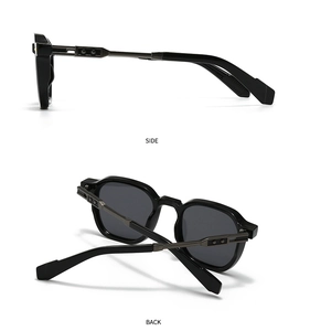 Detail view of round metal aviator sunglasses with dark lenses and metallic hinge accents