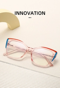 Detail view of pink transparent frame glasses with metal core and red blue accents